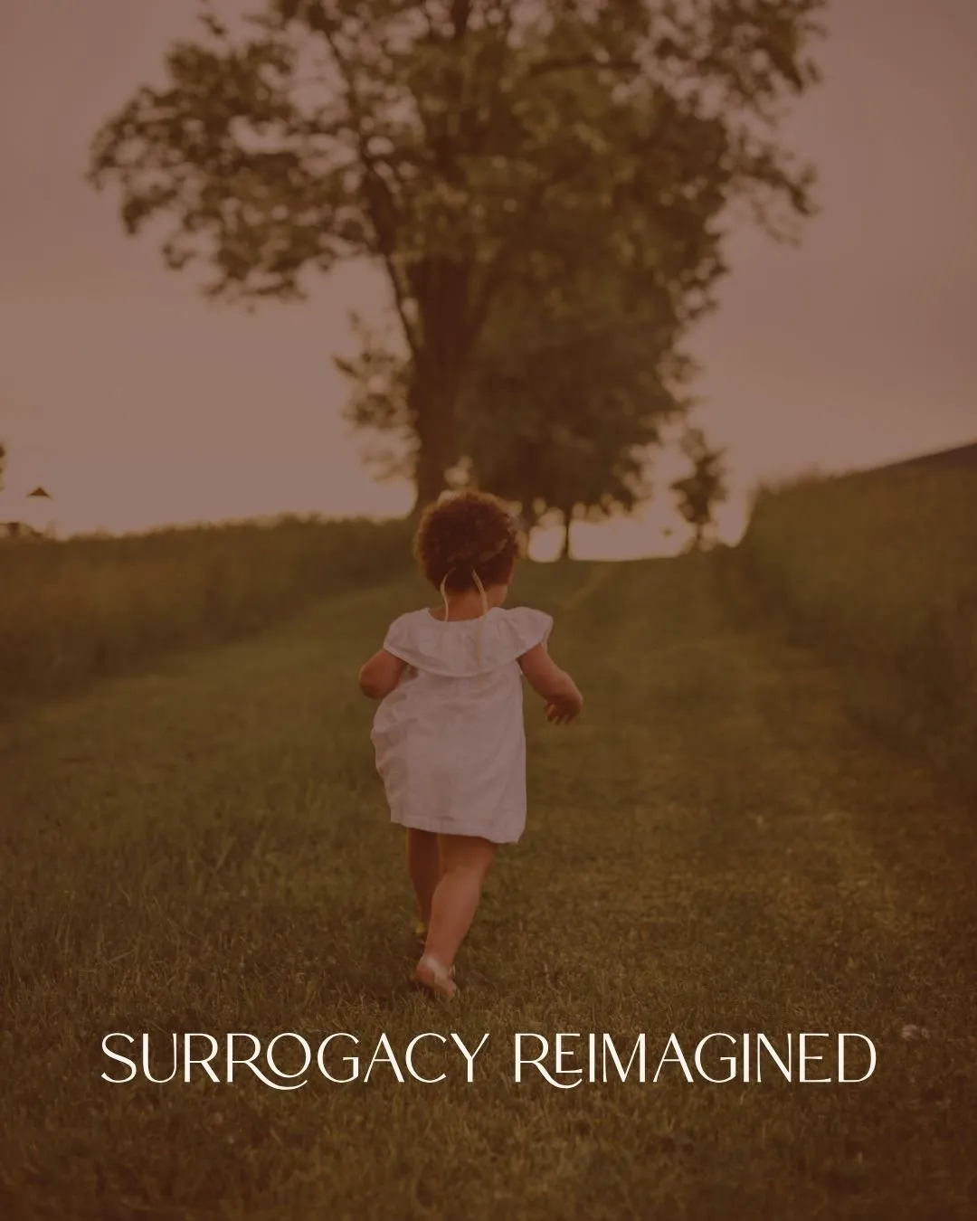 A young child running outdoors on a grassy path